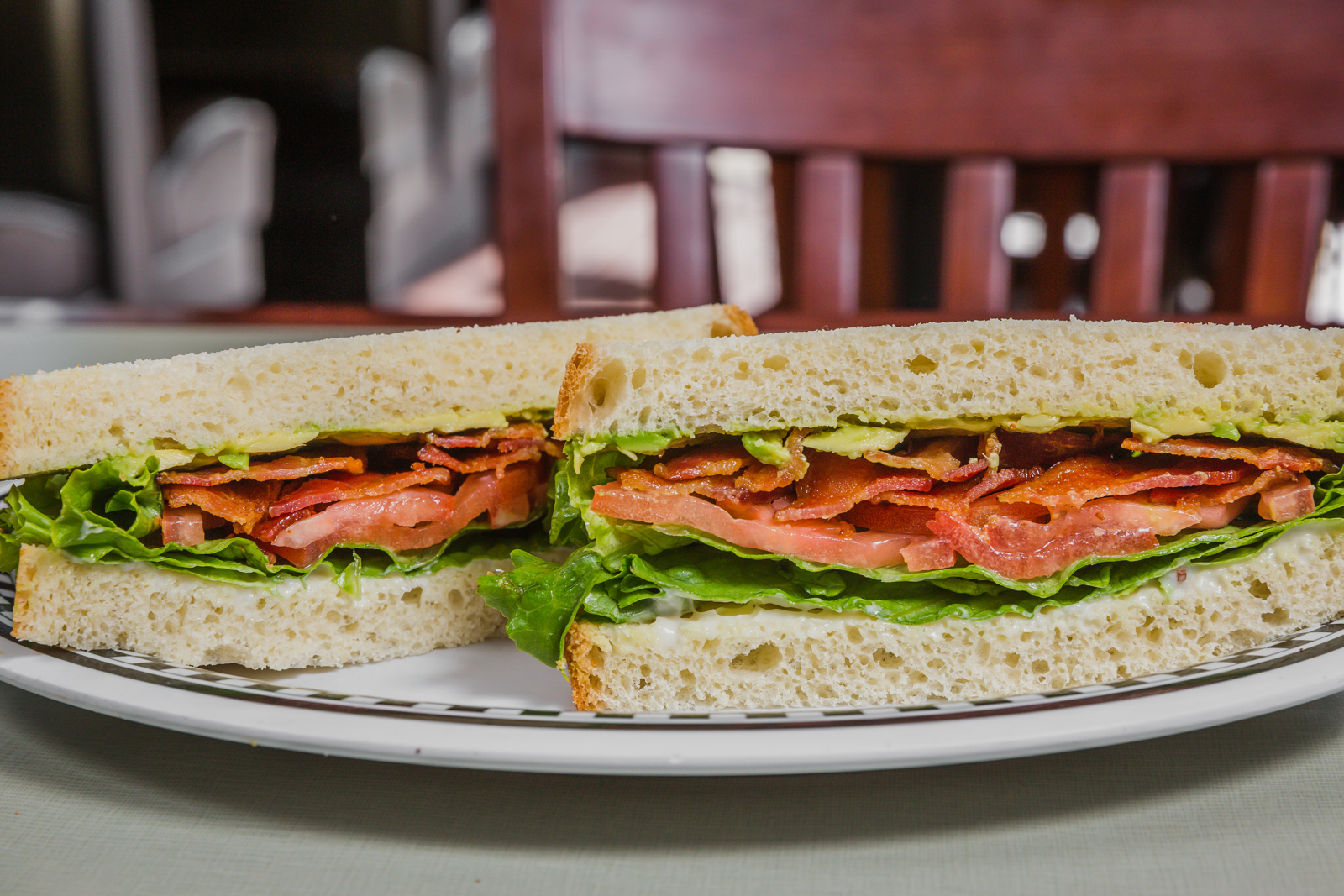 BLT with Avocado served on Wheat Bread with bacon, lettuce, tomato, onion, avocado
