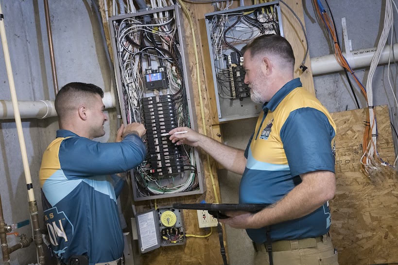 Thomas Edison Electric technicians performing electrical panel upgrade and wiring work as part of residential electrical service in Pennsylvania