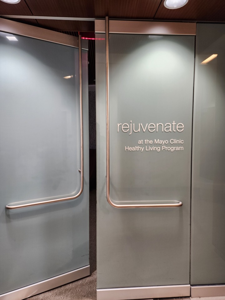 Entrance door displaying the Rejuvenate Spa name and branding