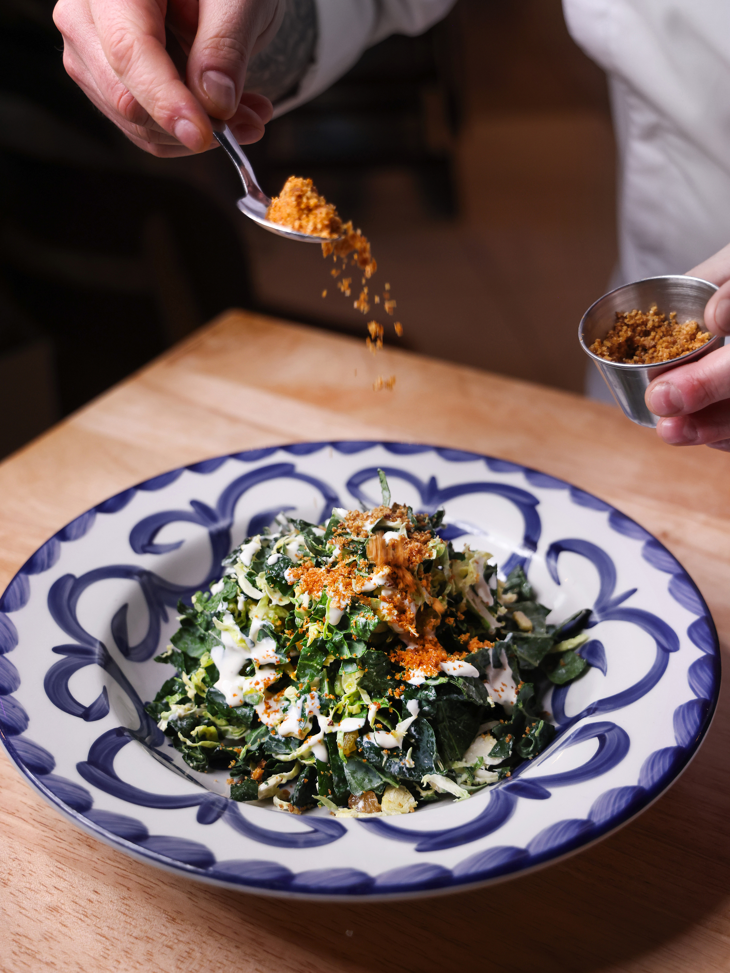 Crisp greens topped with house-made dressing and savory breadcrumbs. 