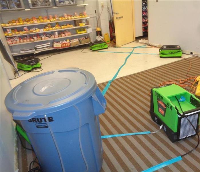 Due to all the resent rains a small crack in the wall lead to a whole lot of water to leak into this stores warehouse and show room leaving the carpets soaked. SERVPRO was called out to help dry that walls and carpet without halting their business hours. Luckily the techs were able to do just that and make it look 