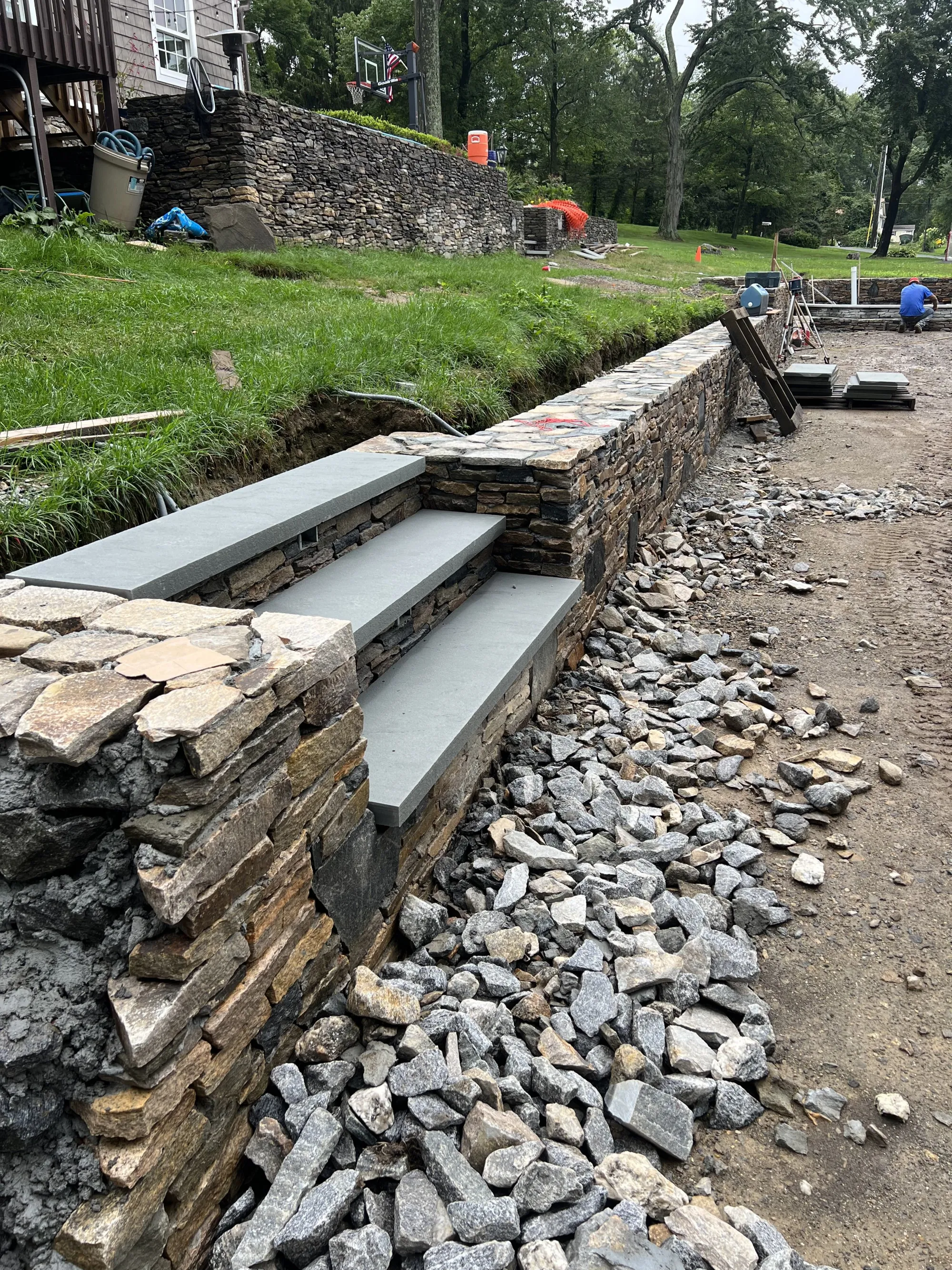 Front entrance stone steps and landing - Stone Steps project by General Masonry LLC.
