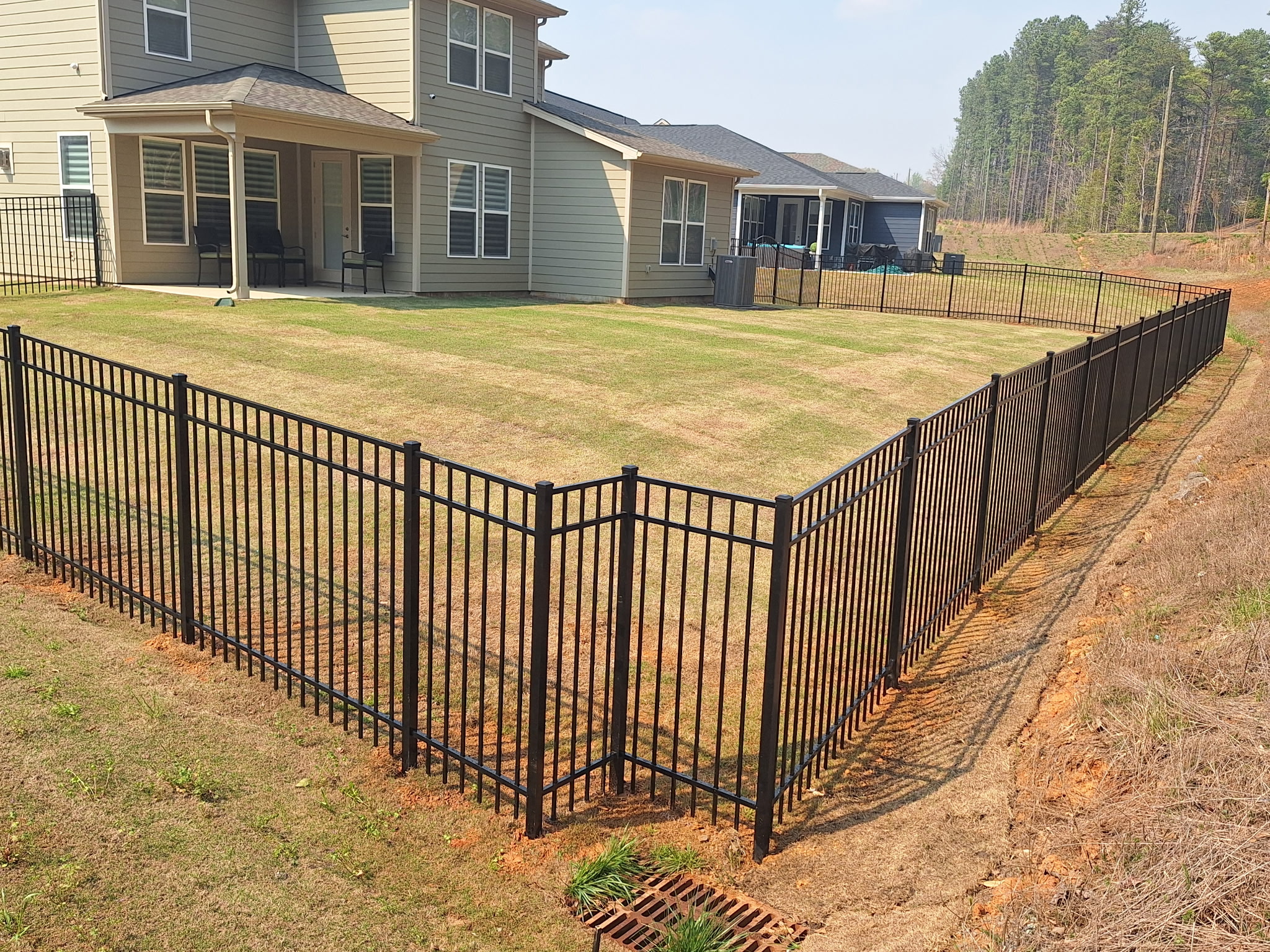 Cut out around a drain with aluminum fence