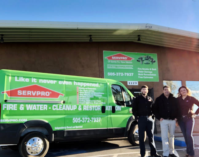 SERVPRO of Santa Fe front of building with business wrapped van and management crew.