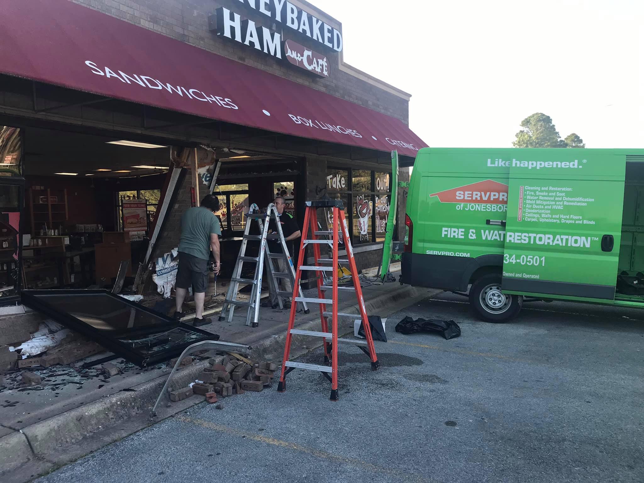SERVPRO team working to restore The Honey Baked Ham Company after a crash occurred.