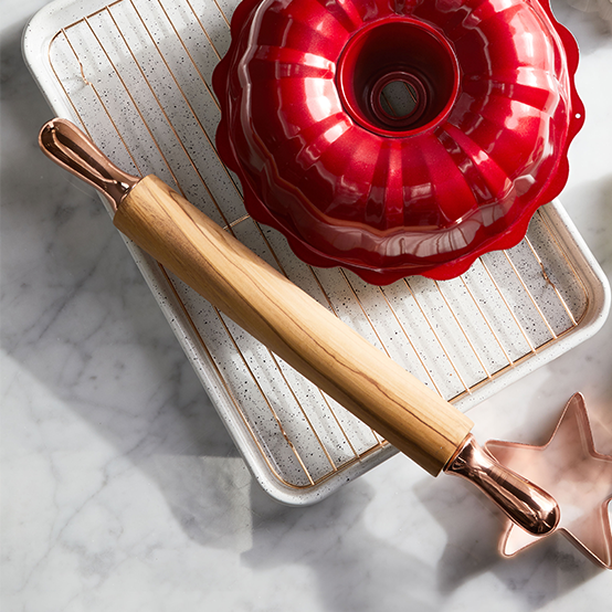 Red cake pan and rolling pin