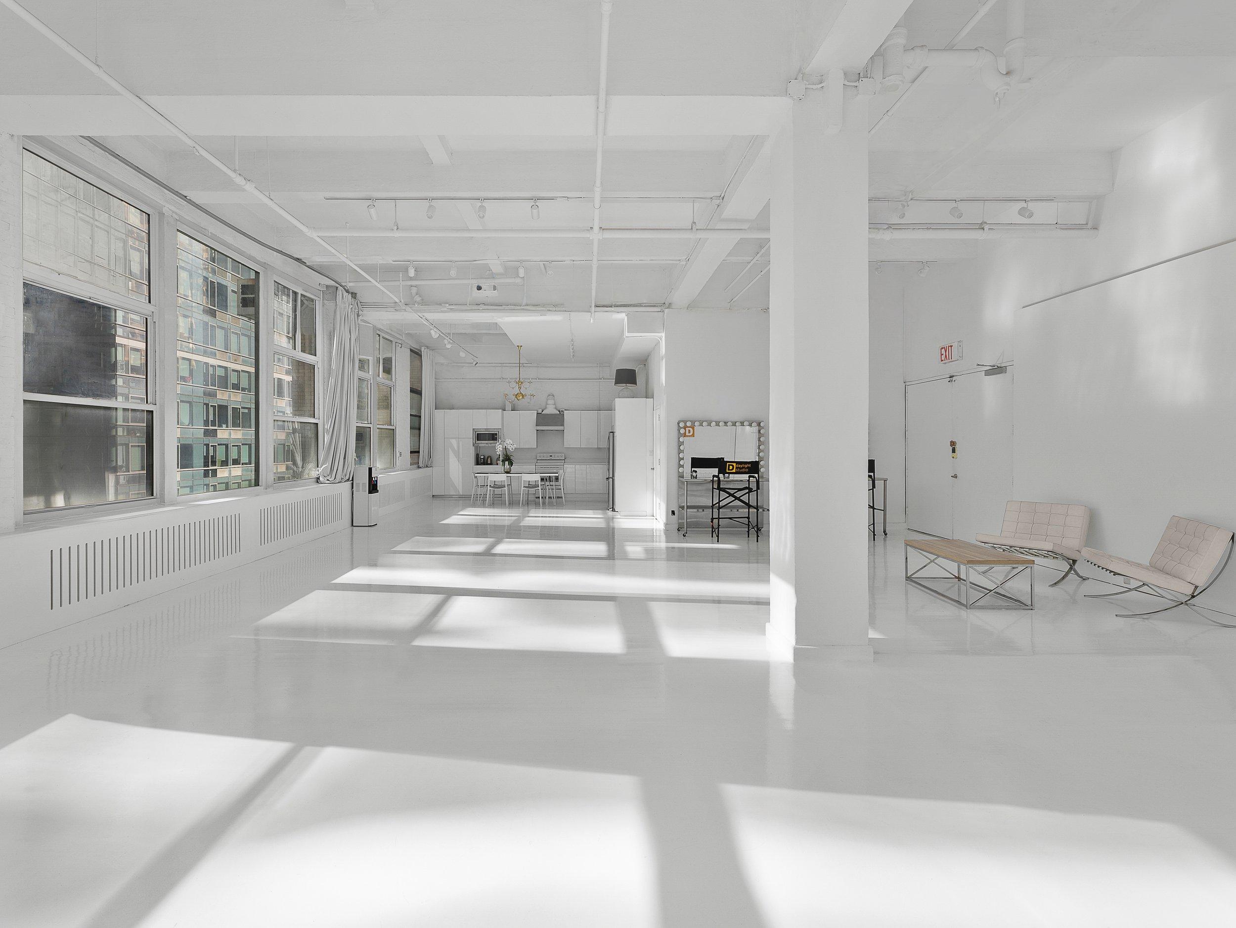 2,300 SF Studio 9, Venue Hudson Yards NYC, white open fully functional kitchen, food and still life photography, natural daylight, white floors, 15' ceiling, food shoot and production studio rental New York.