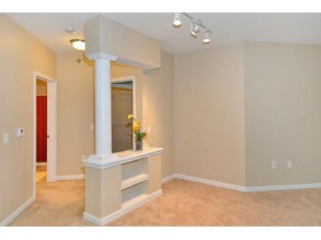 a living room with a white column 