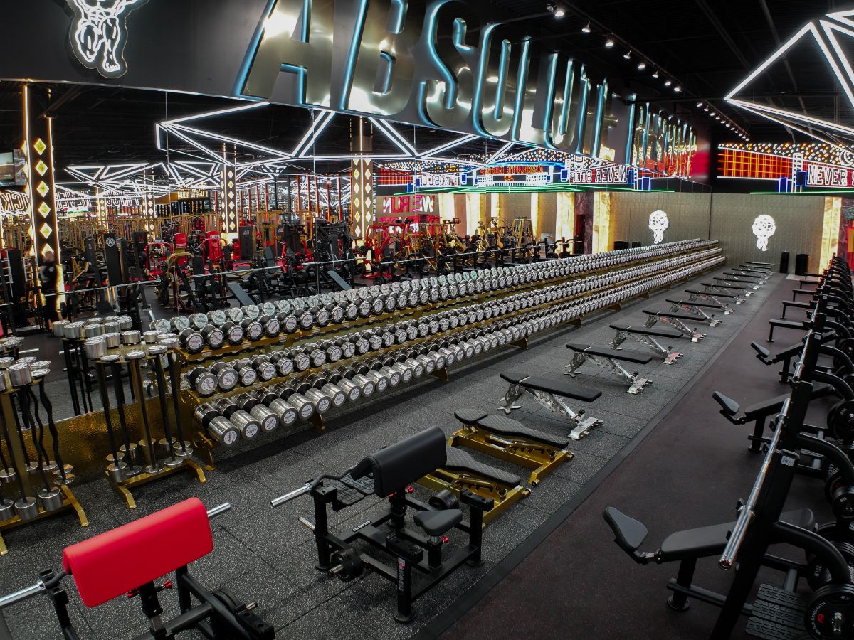 Large free weight area with dumbbells, benches, and strength equipment at our Lombard gym.
