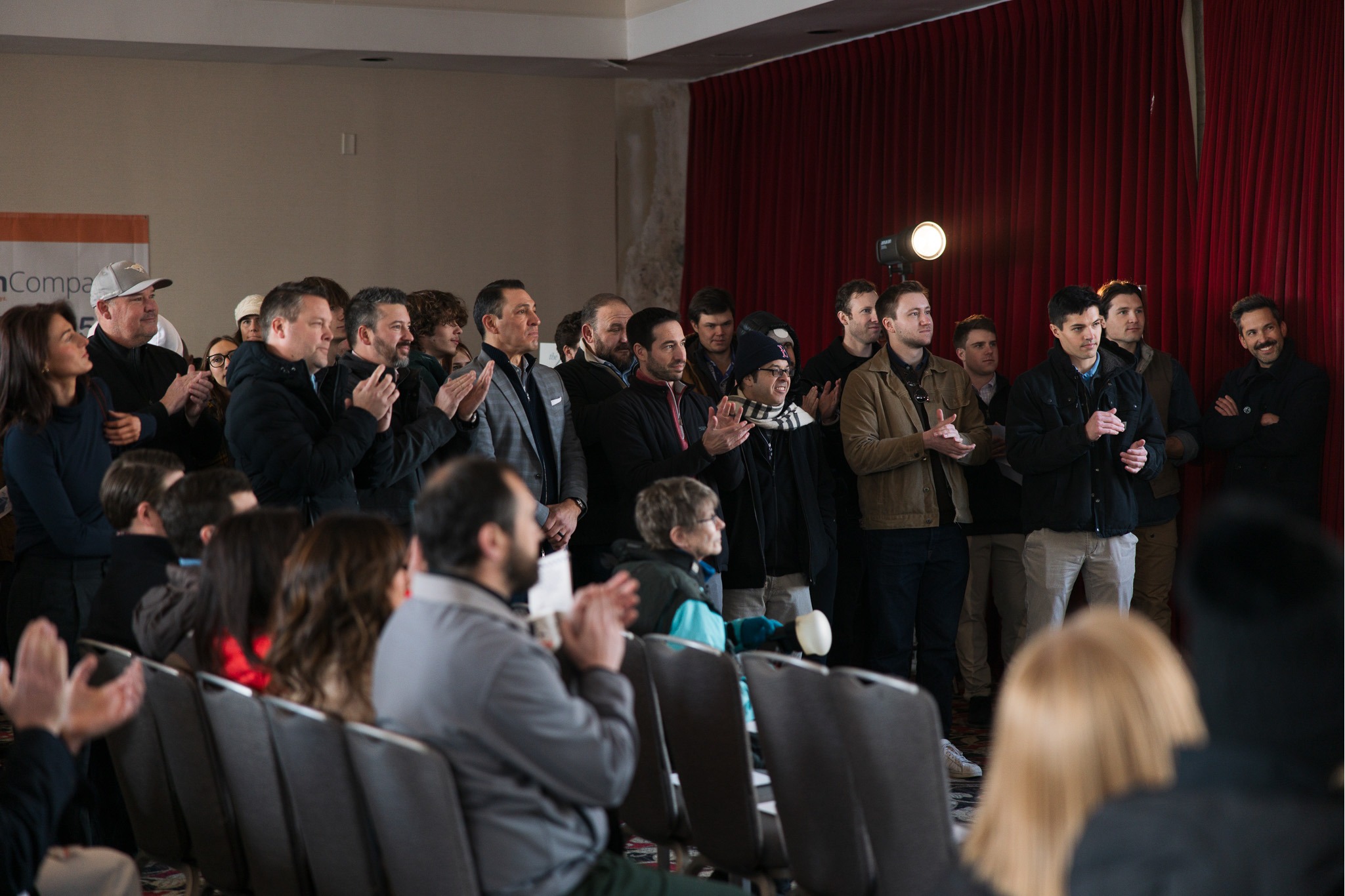 Industry event hosted by Molzer Development featuring real estate professionals and community leaders discussing urban development and investment opportunities in Kansas City.