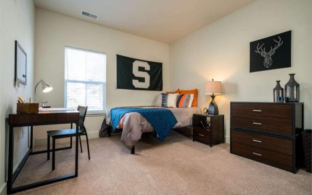 Fully Furnished bedrooms with desks and storage.