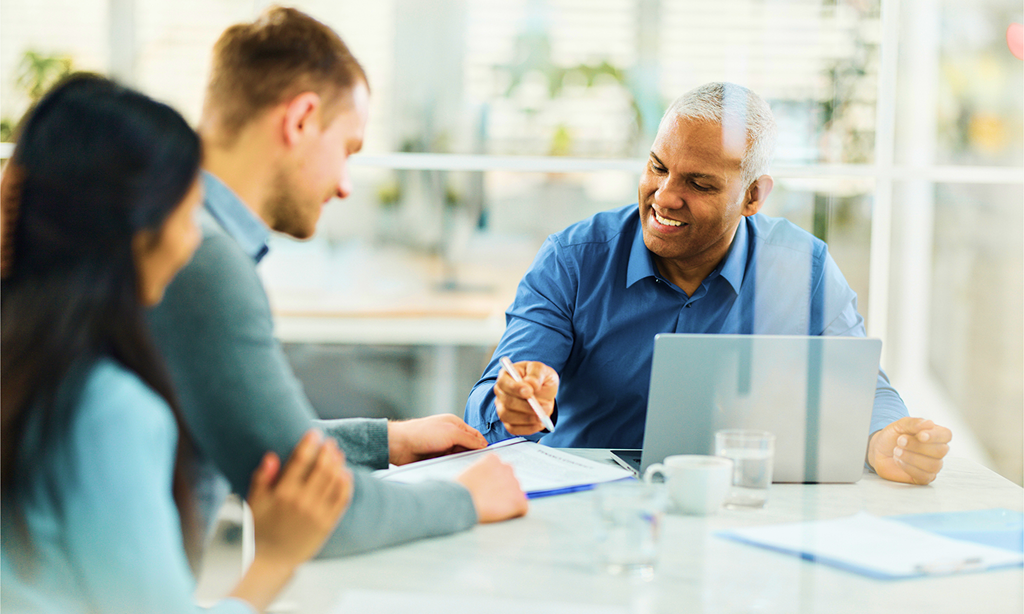 A wealth professional working with clients.