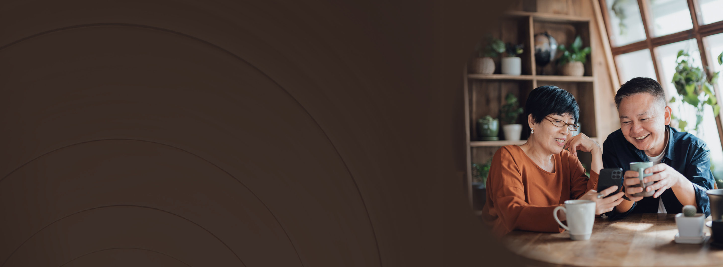 A couple sharing a coffee in a nice kitchen setting.