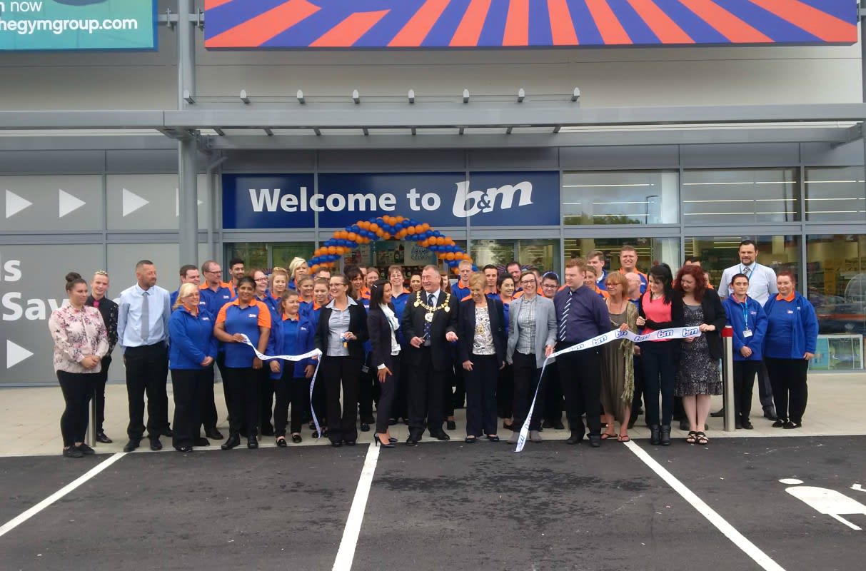 Local Mayor, David Wildey cuts the ribbon to officially declare the new B&M Strood store 'open'.