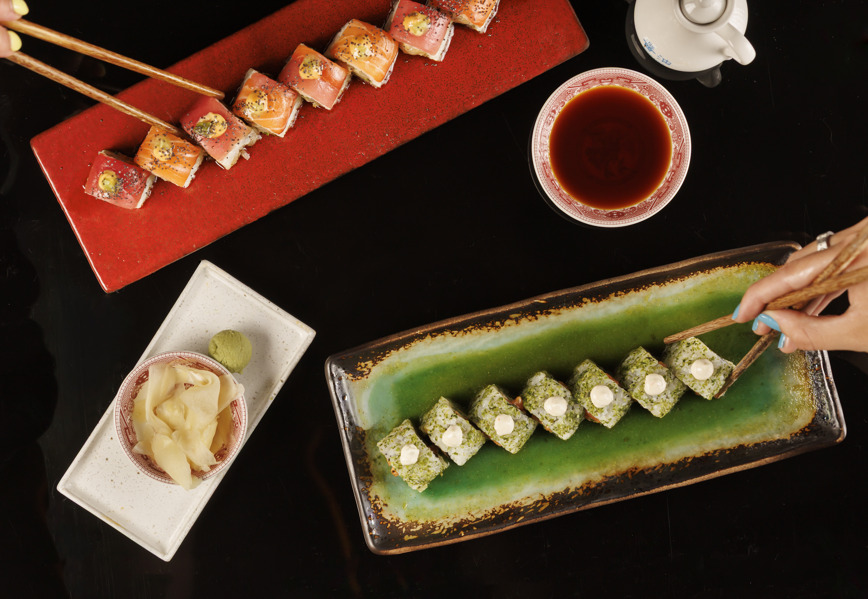 Mr. H signature sushi rolls featuring the Jade Roll with spicy salmon, avocado, cucumber, jalapeño p 