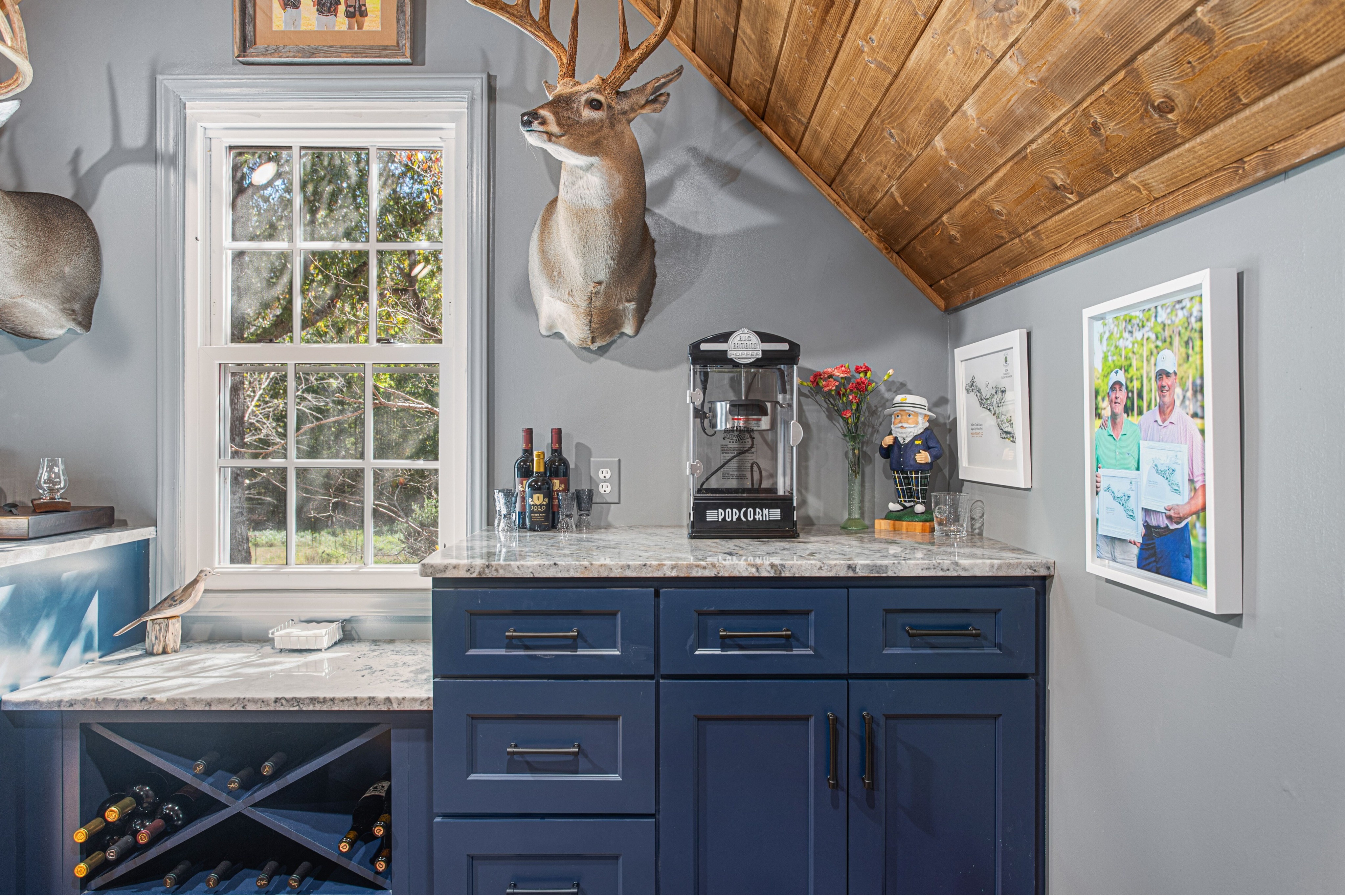 Custom interior cabinetry installation in Central North Carolina with wood ceilings, built-in storage, and premium finishes. This renovation highlights quality craftsmanship and custom residential construction near the Badin Lake area.