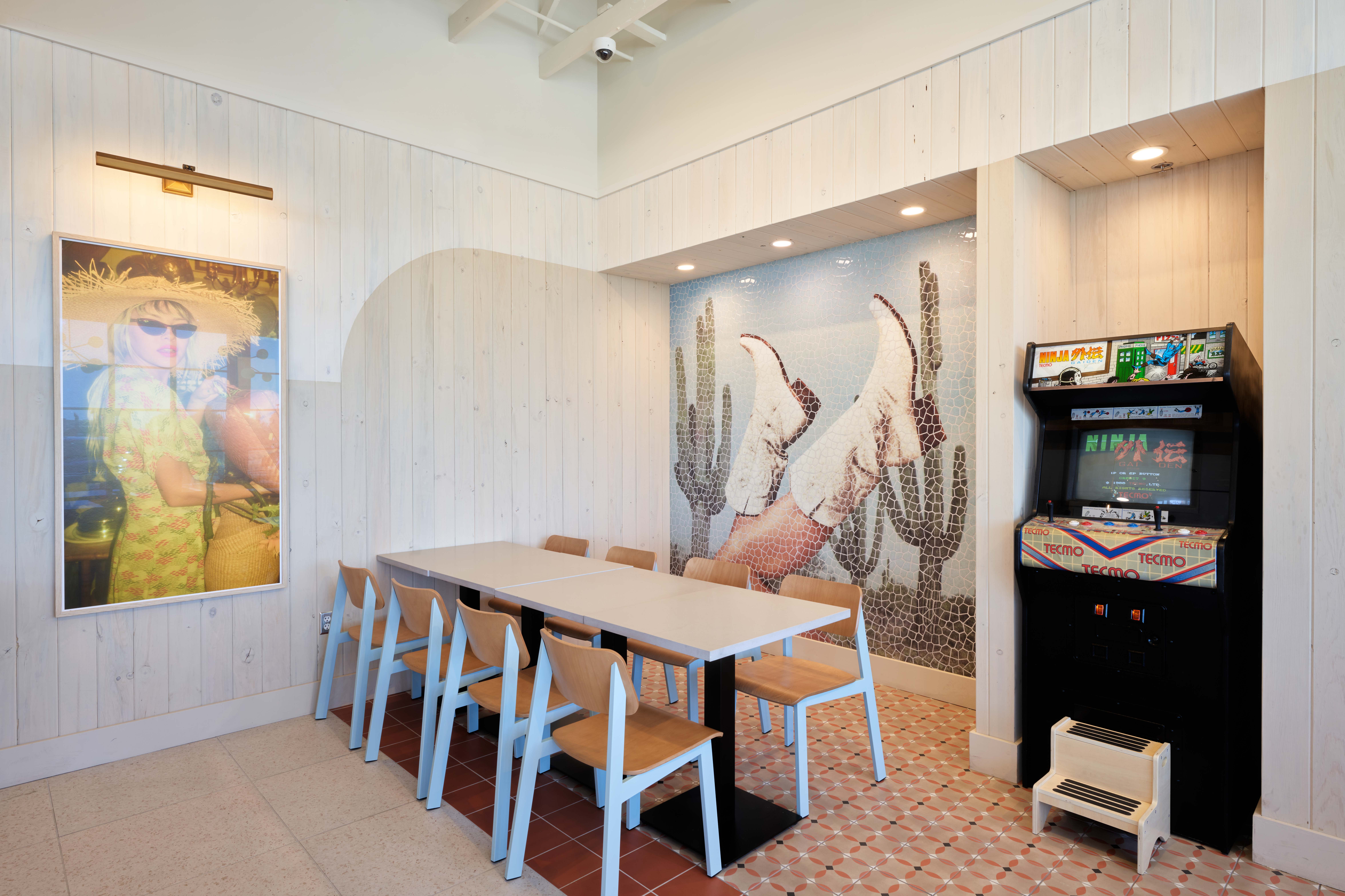 Interior of Birdcall SanTan Village with a free play arcade game