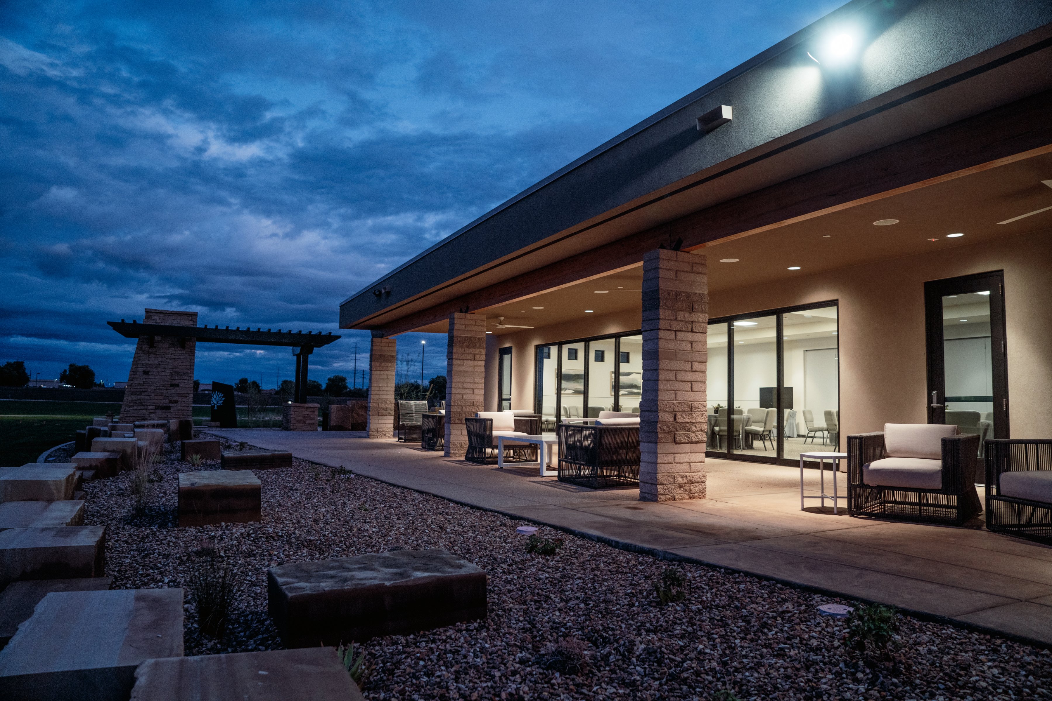 The covered patio at Gilbert Memorial Park, with seating that looks out over the grounds.