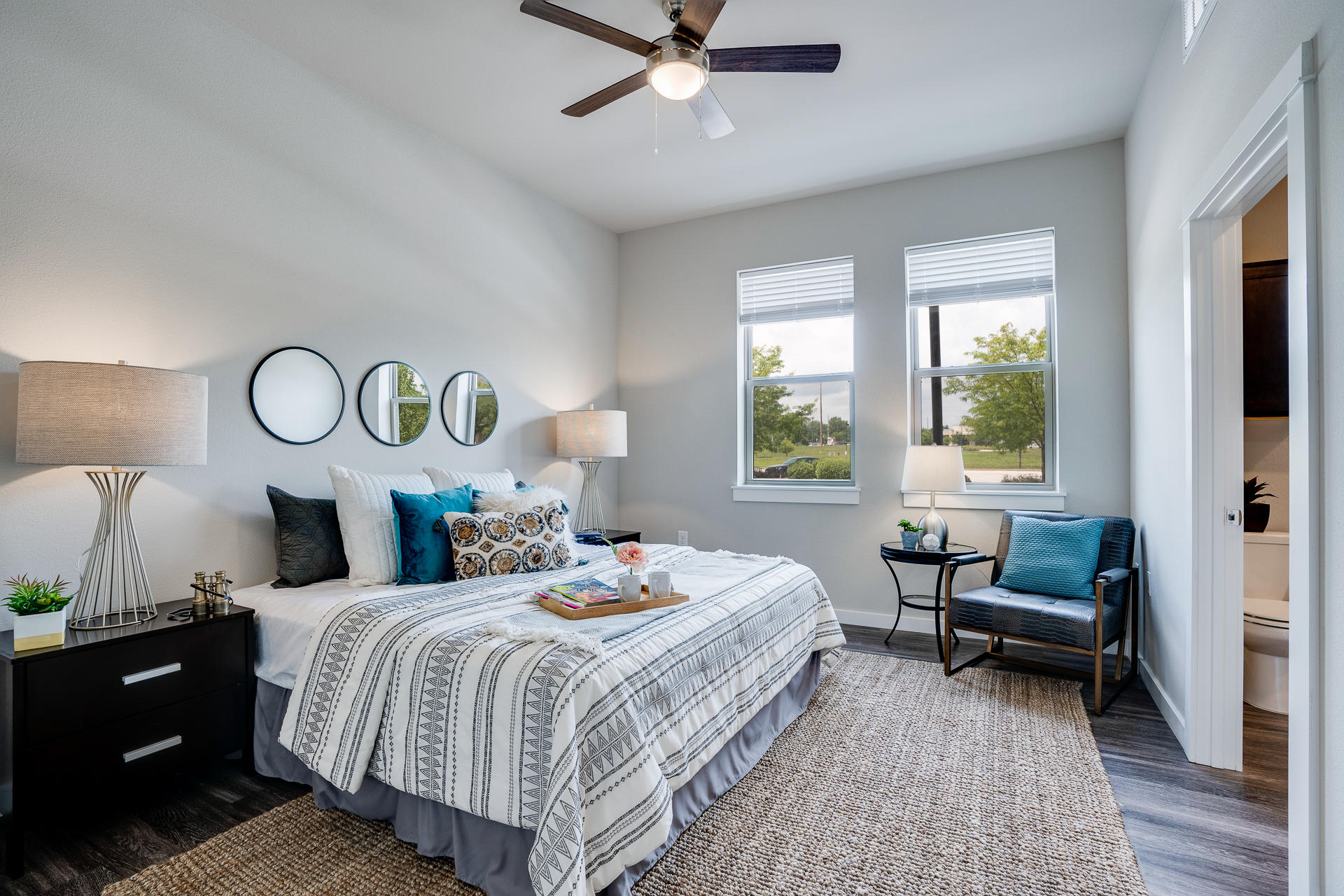 Bedroom Featuring Tall Ceilings With Attached Bathroom