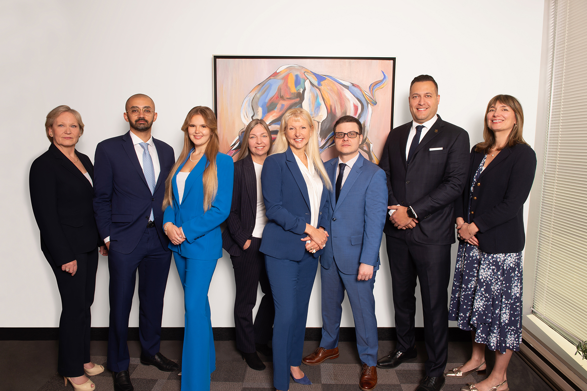 The Racine-Marcotte Advisory Group team photo with abstract bull artwork
