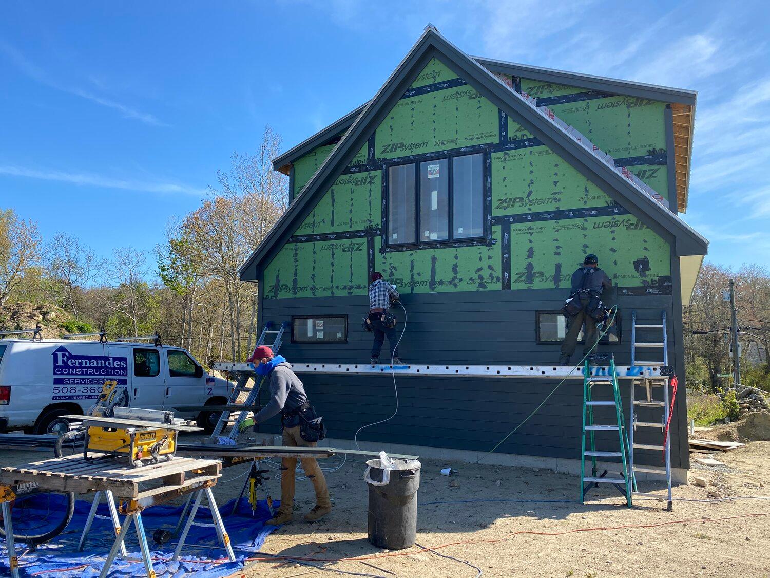 Fernandes Construction using James Hardie cement board and HardieTrim Boards trim installation on a home on Cape Cod