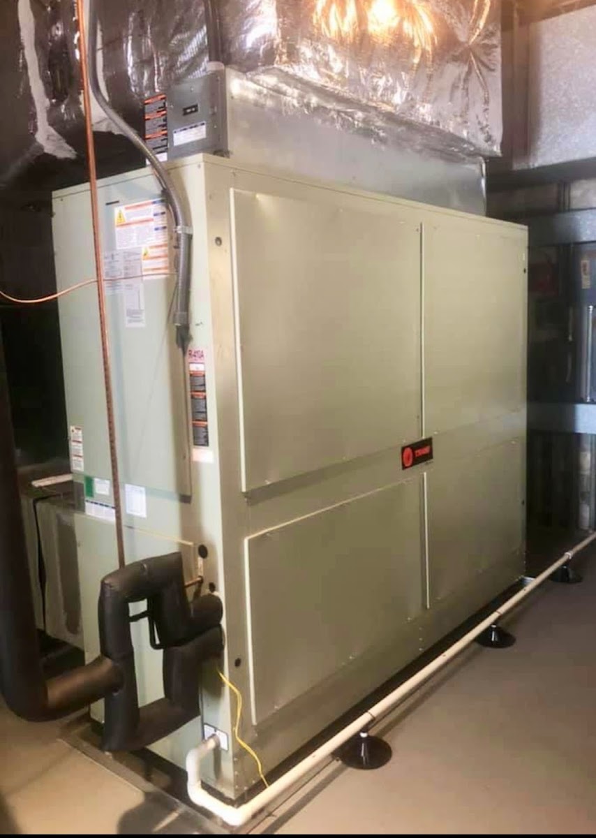 Indoor HVAC air handler installed with professional duct connections to support efficient heating, cooling, and airflow.