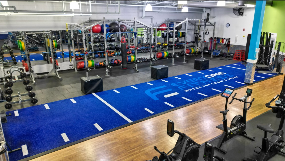 Blue turf functional training zone at Everyone Fitness Rehoboth Beach designed for agility, sled, and HIIT workouts.