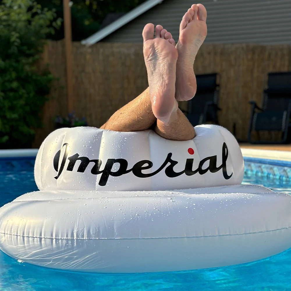 The Tour Visor&reg; Pool Float in use. The raised crown doubles as a backrest.