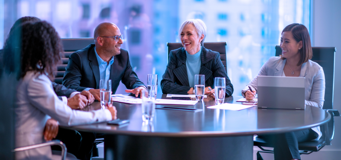 A group of people in a boardroom.