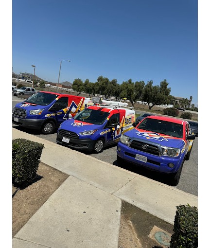A fleet of Aced It! Cooling & Heating branded vehicles parked in Corona, CA, featuring bold and vibrant designs in red, blue, and yellow. The image highlights the company’s strong local presence and readiness to provide fast, reliable HVAC services to the community. Perfect for showcasing trust and professionalism.