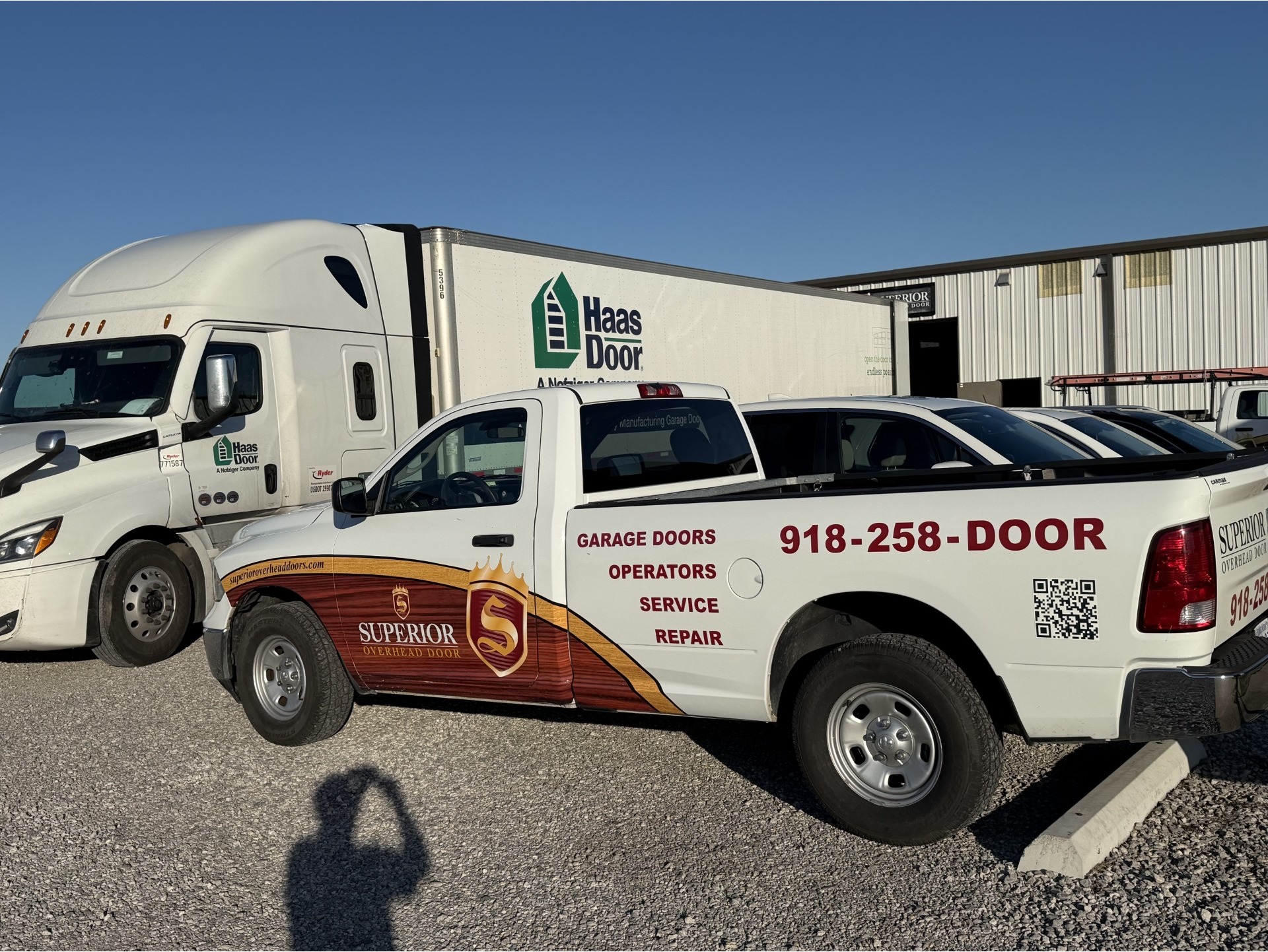 Haas semi truck delivering new doors to Superior Overhead Doors with branded truck out front