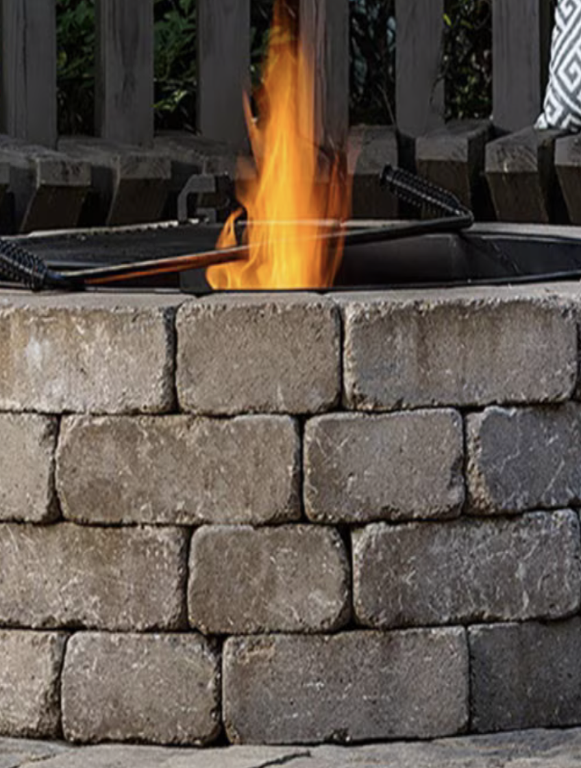 Belgard Weston Stone Fire Pit Round Colonial 39 inches. Features the clean, contemporary look of tumbled stone that complements any surrounding hardscape.
Constructed with high quality Belgard wall products that provide a much better alternative to a brick fire pit kit. Can be installed as either a wood-burning or gas-burning fire pit.
Ensures years of enjoyment and beauty
The Weston Stone Fire Pit will instantly become everyone's favorite gathering spot. Family members of all ages will love sitting around the fire pit together, sharing stories, roasting marshmallows and enjoying time together. Because of this, be sure to include ample room around the stone fire pit kit for seating and gathering. You may even want to include built-in seat walls to provide permanent seating.
APEX
Cary
Fuquay-Varina
Holly Springs
New Hill
Morrisville
Feltonville
Friendship
Moncure
Wilsonville
Bells
Pittsboro
DURHAM
Morrisville
Research Triangle Park
Cary
Carpenter Village
Clegg
Carrboro
Genlee
Southpoint
Bethesda
Mebane
Blands
Oak Grove
Chapel Hill
Hillsborough
Friendship
RALEIGH
Rolesville
Knightdale
Wake Forest
Wendell
Zebulon
Youngsville
Lizard Lilck
Eagle Rock
Wakefield
GARNER
Clayton
Willow Springs
Smithfield
Wilsons Mills
Archer Lodge
Fuquay-Varina
White Oak
Glen Laurel Road
Auburn
Turner Farms
Clevelands Oaks
Riverwood Dr
Flowers
McGee Crossroads
Siteone Landscape Supply
Triangle Landscape Supplies