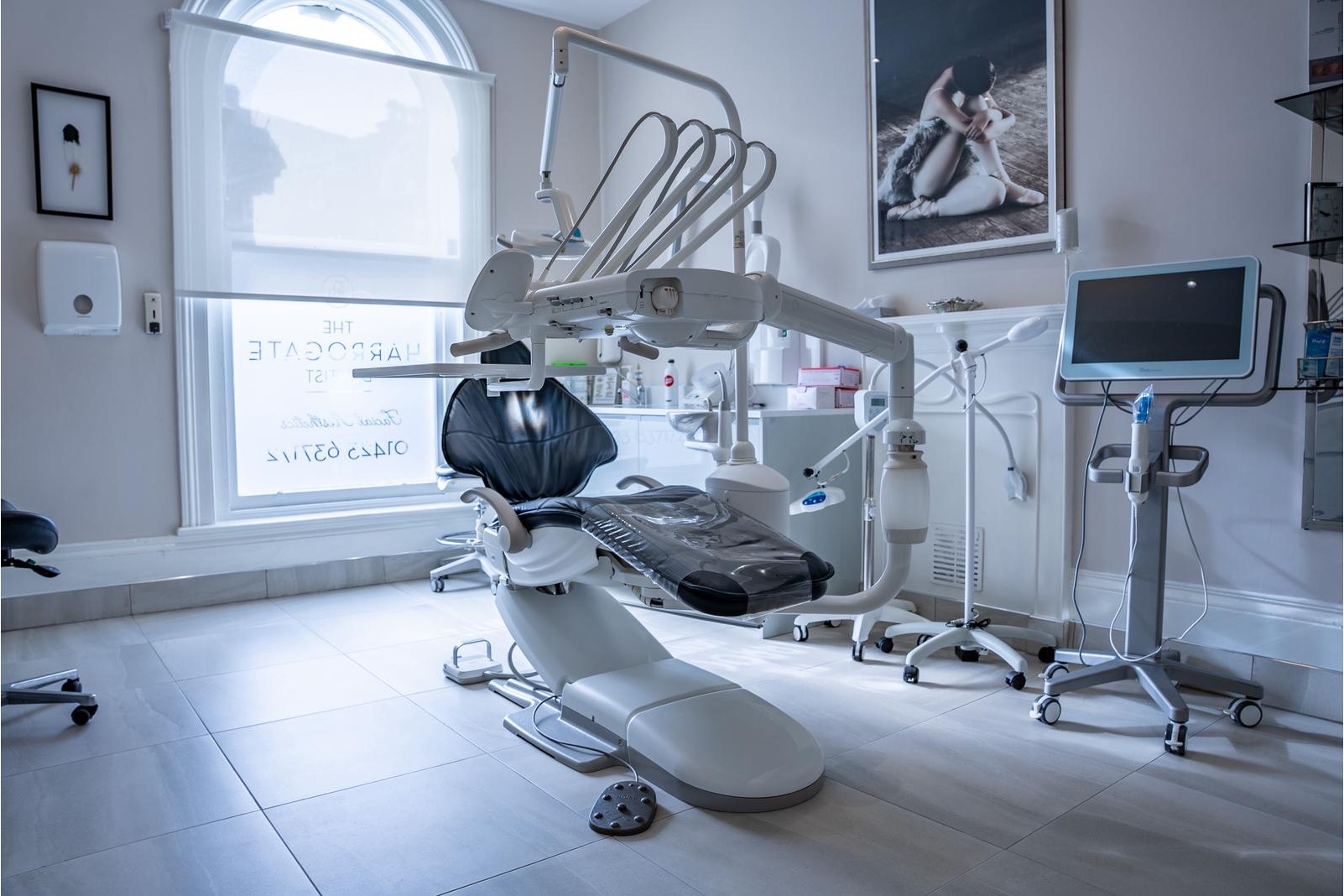 State-of-the-art dental treatment room at The Harrogate Clinic featuring a modern dental chair, digital screen, and professional equipment in a luxurious Harrogate clinic setting.