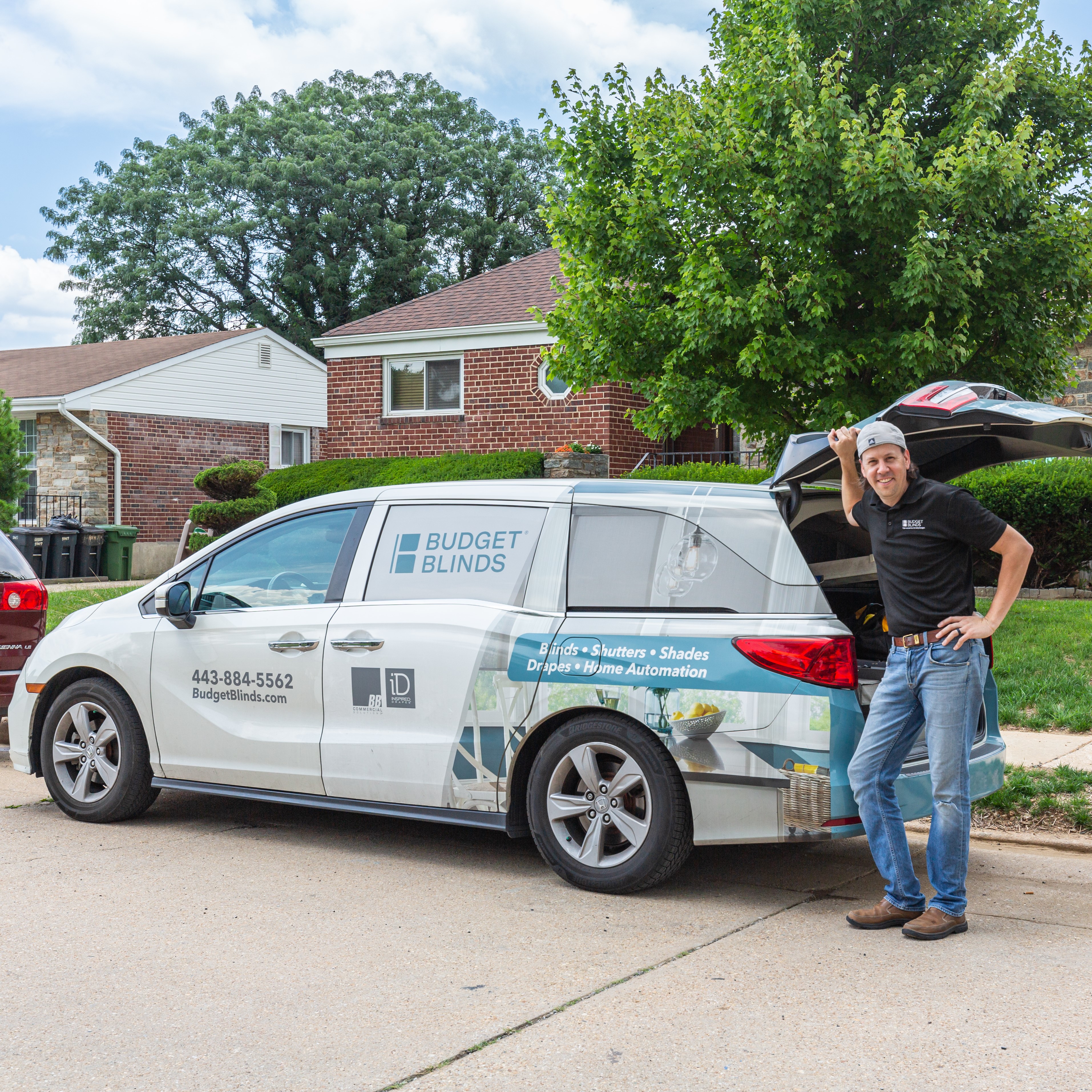 Budget Blinds of Greater Baltimore owner, Caleb with the Budget Blinds van