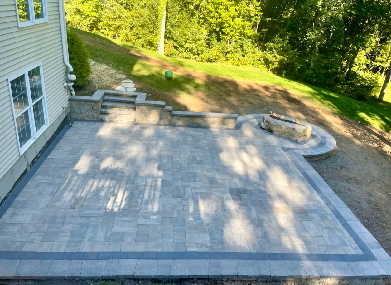 Patio pavers laid in a running bond pattern - Patios project by General Masonry LLC.
