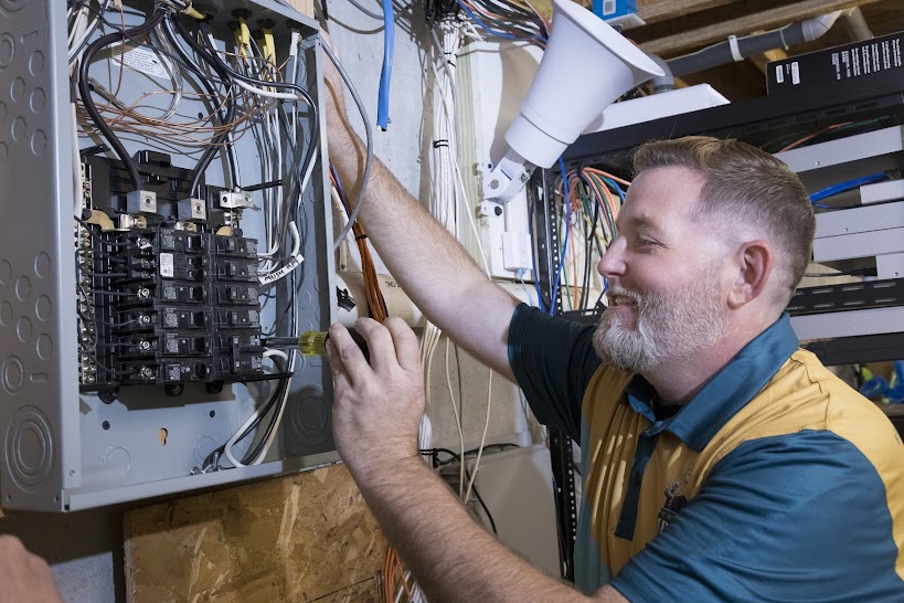 Thomas Edison Electric technician performing electrical panel repair and wiring work as part of residential electrical service in Pennsylvania