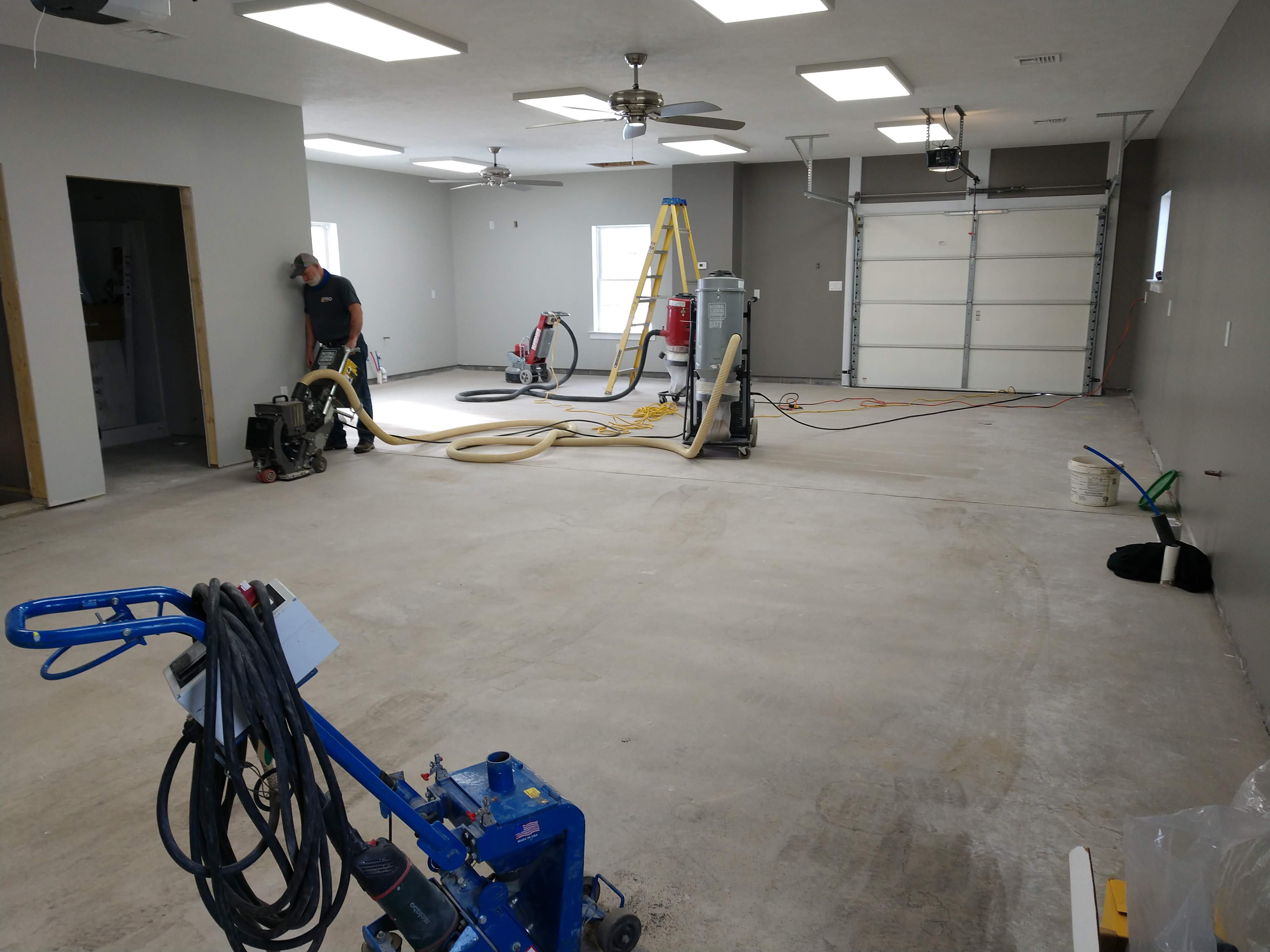 Custom Epoxy garage floor beginning floor preparation in Bellefonte, PA