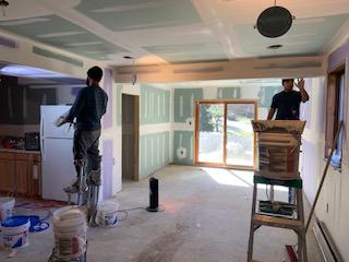 Installing new drywall. Basement remodeling.