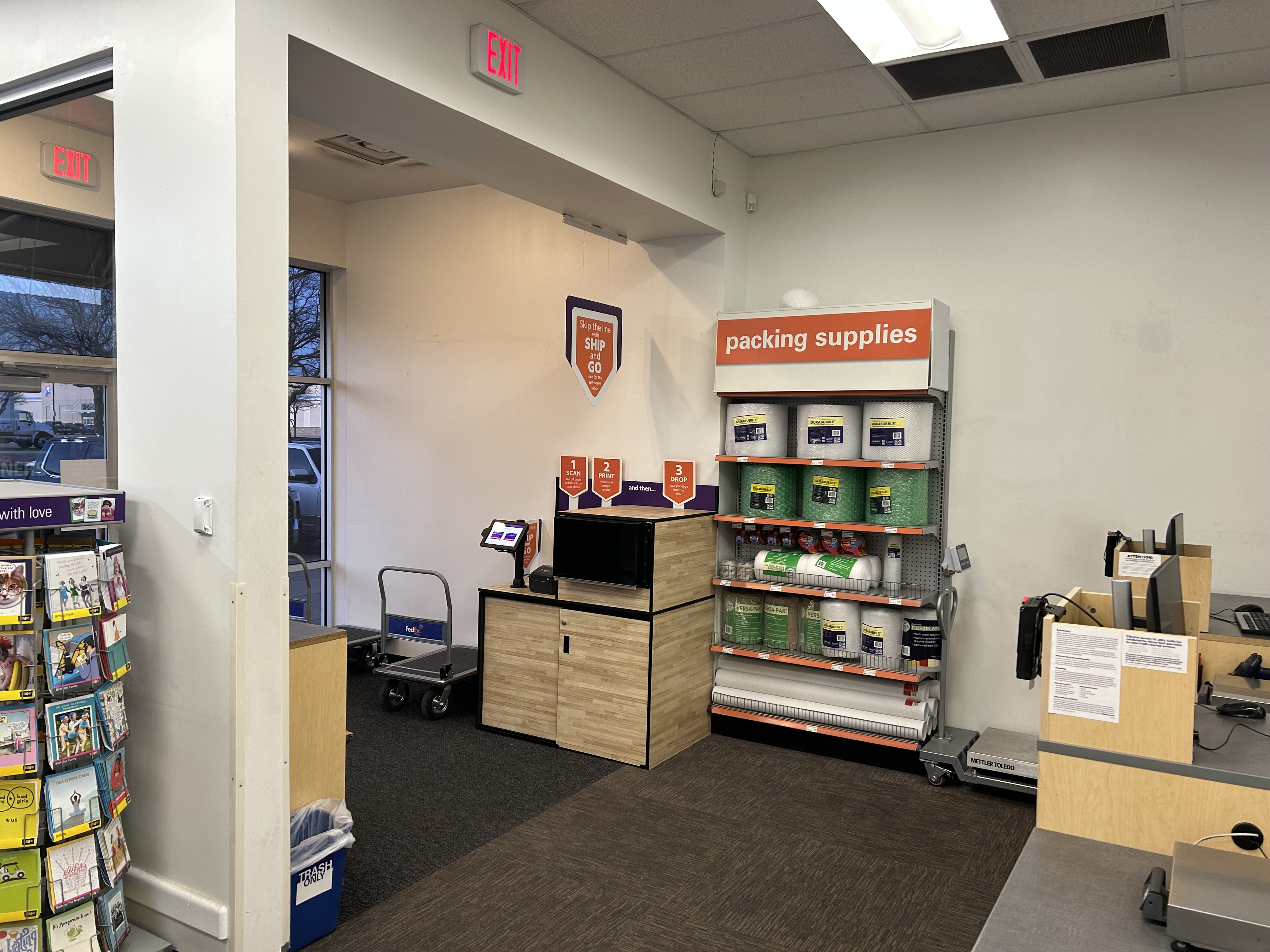 Shipping Supplies and Ship and Go Kiosk &ndash; Packing supplies wall and self-service Ship and Go kiosk at FedEx Office Burleson Texas for quick drop-off and returns.