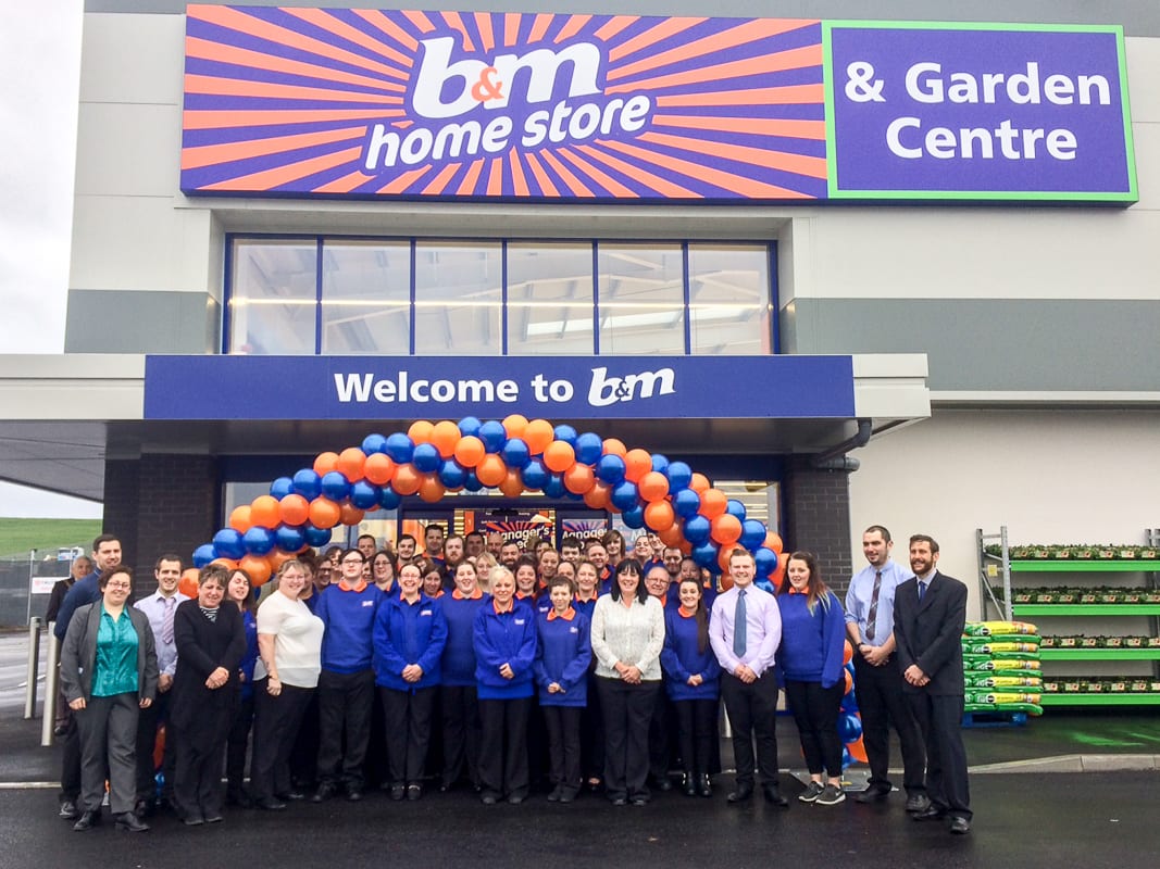B&M Evesham's store team pose outside of their brand new store on Worcester Road.