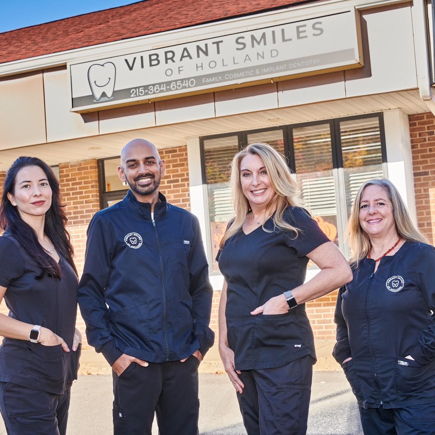 Vibrant Smiles of Holland dental team standing outside the office in Holland, PA