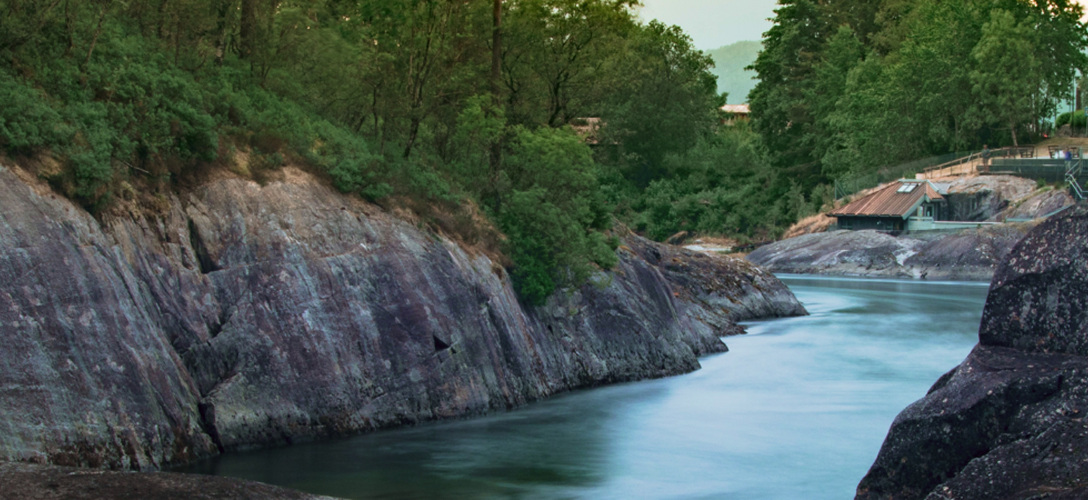 A calm river flowing through rocks.