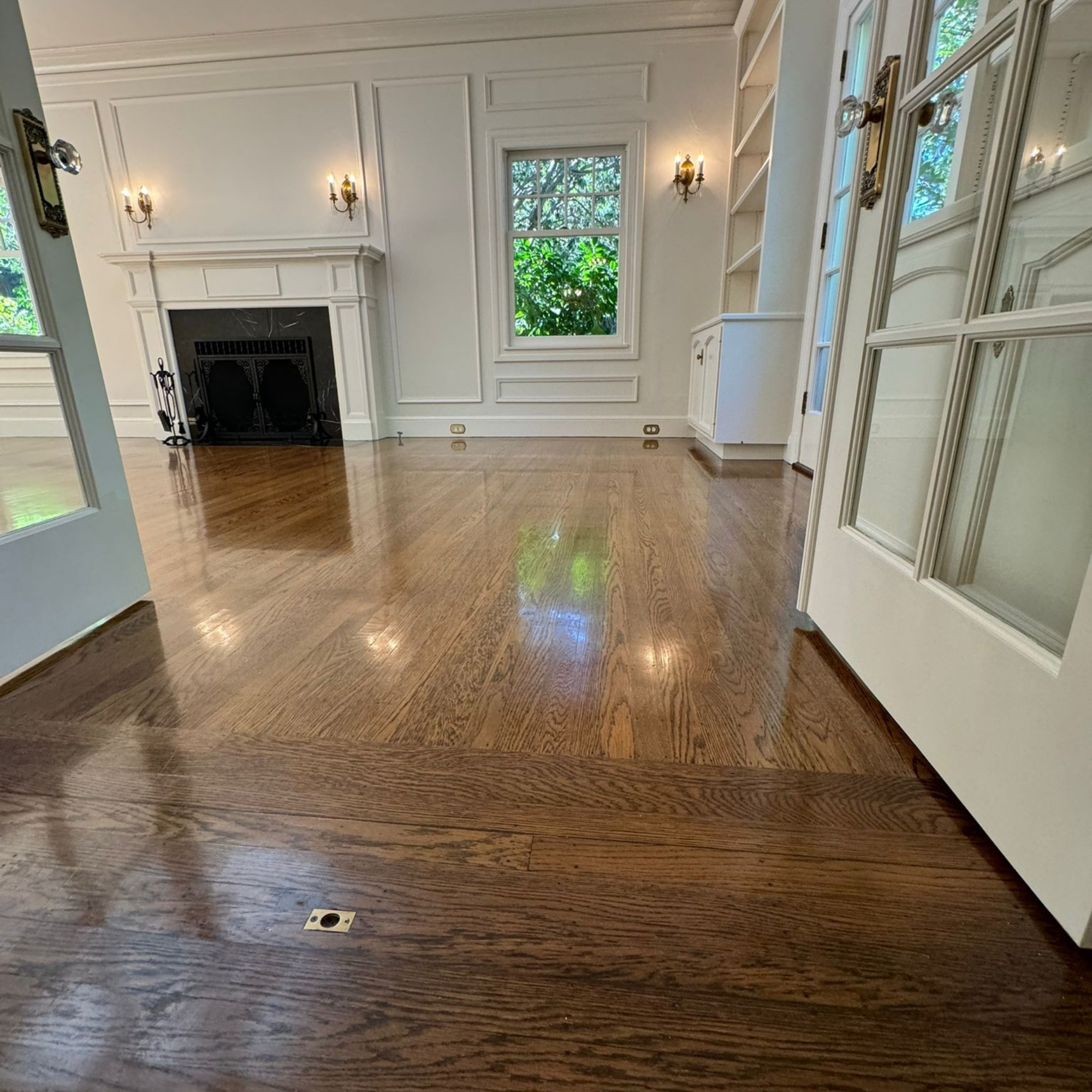 Spacious living room with hardwood floors.