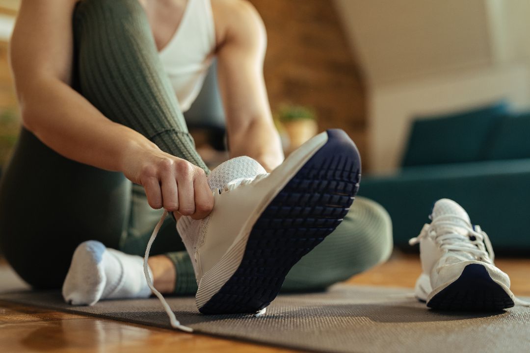 close-up-athletic-woman-putting-sneakers-on.jpg