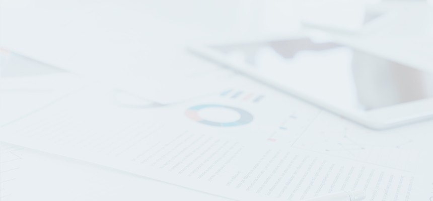 Documents and tablet laid out on a table.