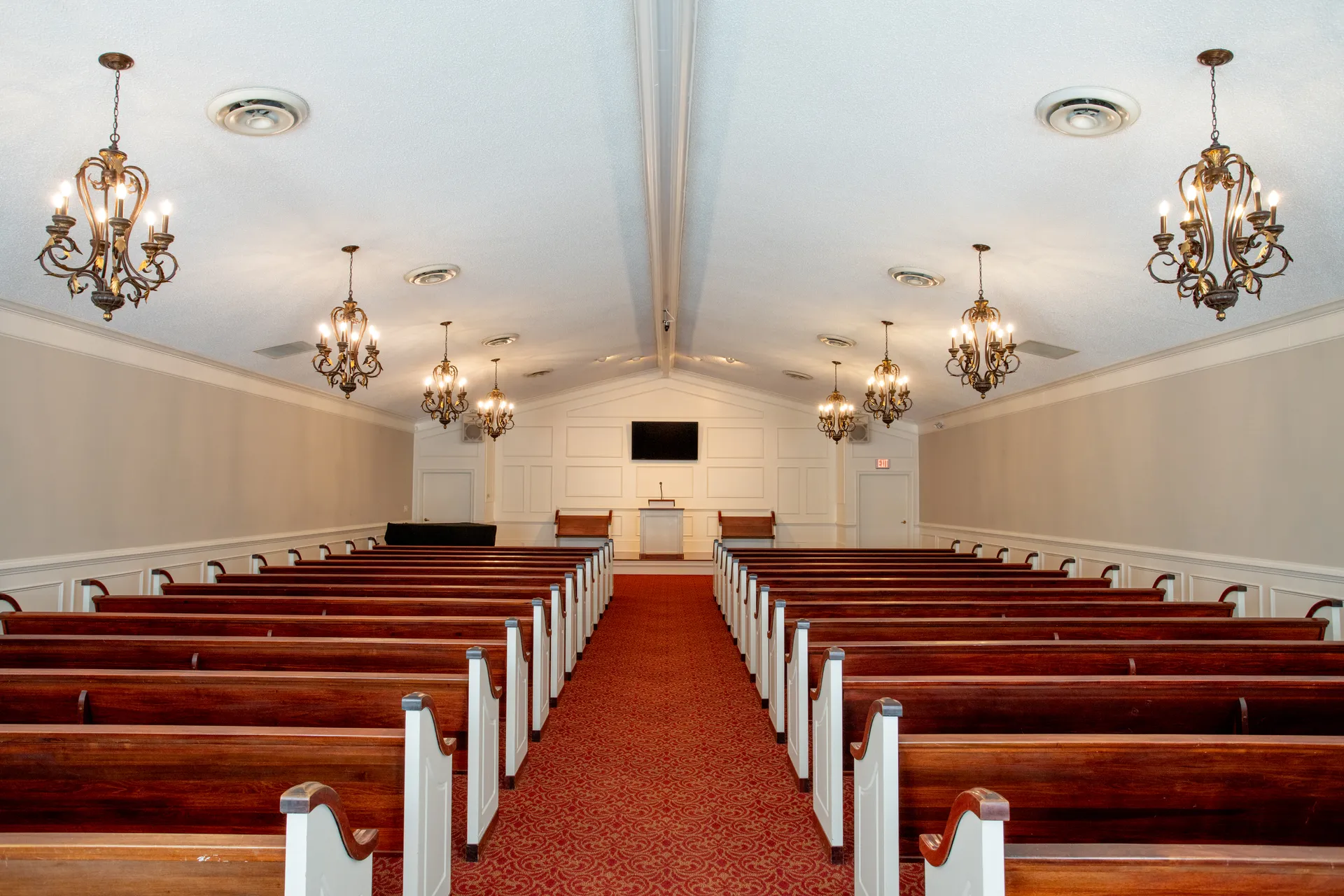 Chapel seating area used for funeral and memorial services.