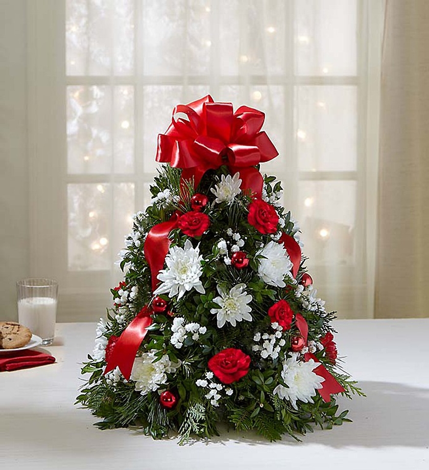 Holiday Flower Tree - EXCLUSIVE You’ve never seen a Christmas tree quite like this! Our best selling holiday arrangement has been a favorite of customers for years, especially because of its compact size, which fits perfectly into small spaces.