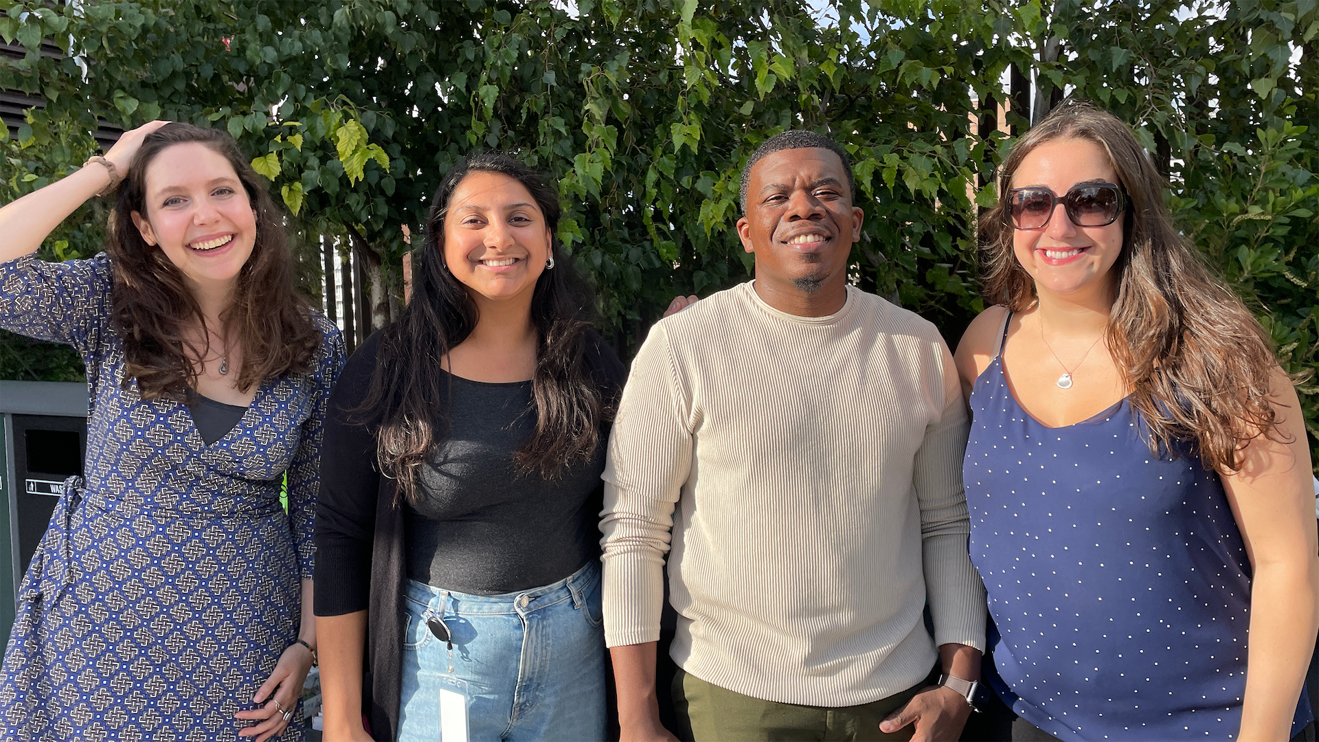 A group of four Yexters smiling.