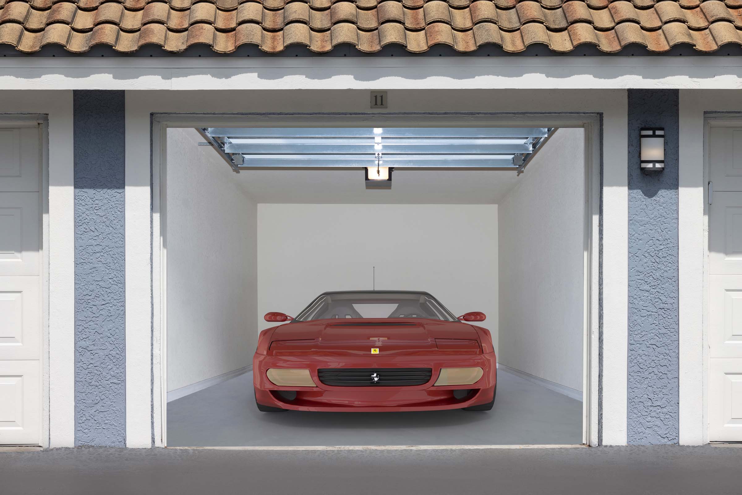 Private garage with car parked inside at Camden World Gateway apartments in Orlando, FL