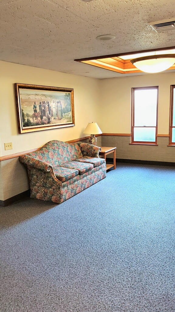 Lobby of The Church of Jesus Christ of Latter-day Saints building in Shelbyville, KY.  Above a couch is a painting of Jesus Christ teaching during His mortal ministry.